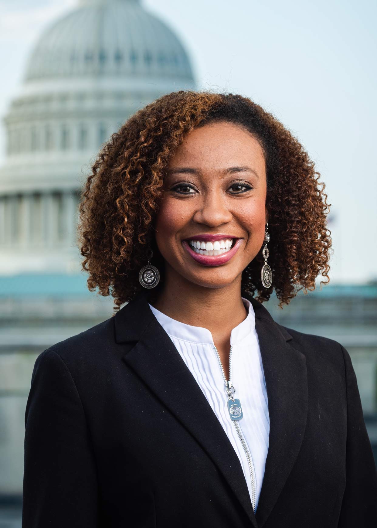 Headshot of a young black woman in business attire.