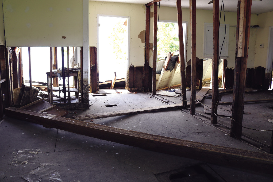 The interior of a house with severe damage from flooding.