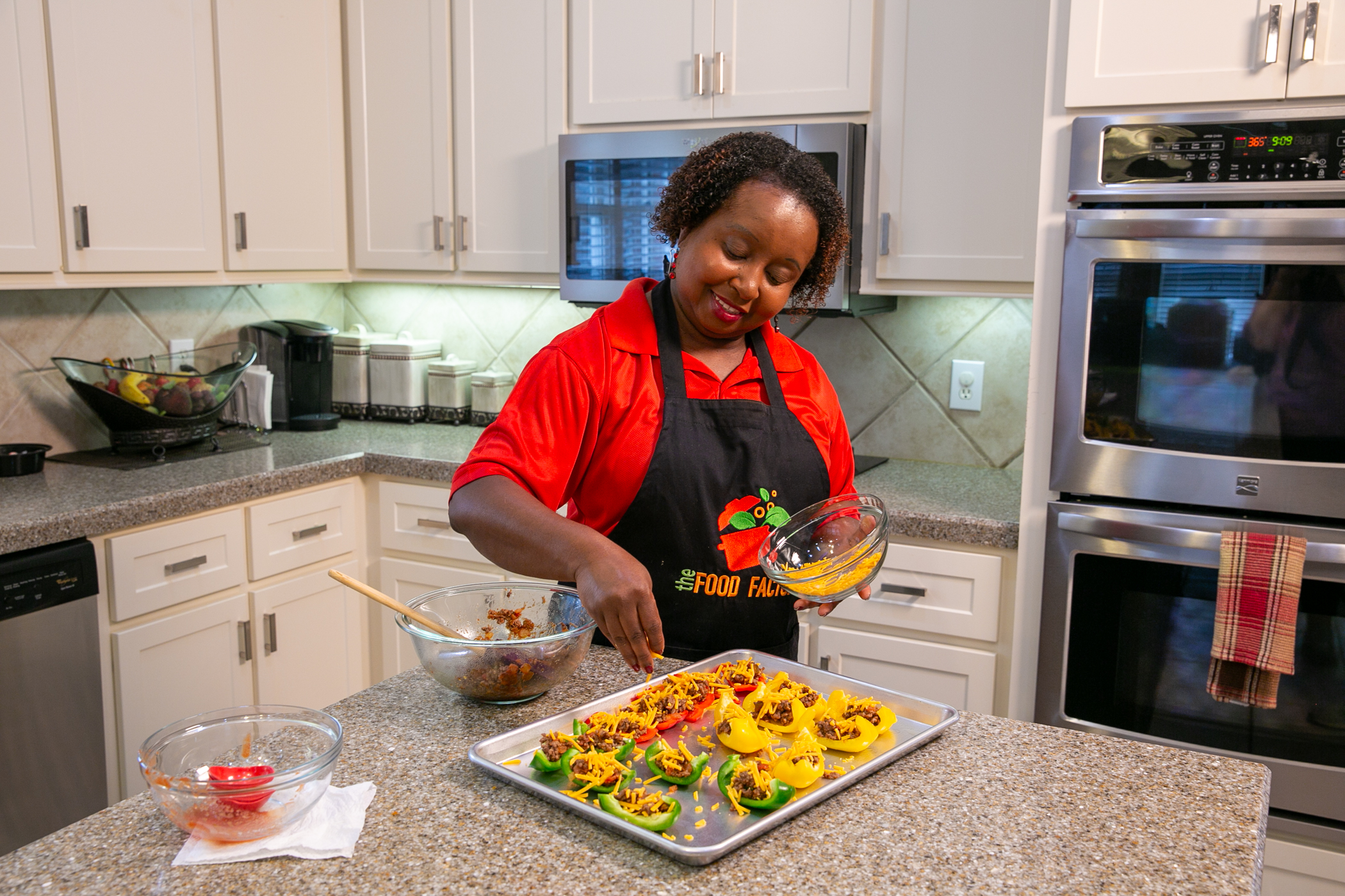 A woman prepares Bell Pepper Nachos in a kitchen.