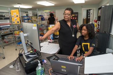 Demi Johnson working at the Willie Lock Resource & Referral. Photo by Kevin Hudson.