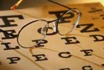 image of an eye chart and glasses