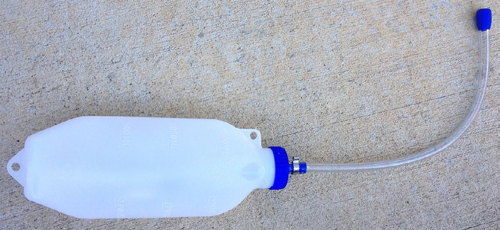 plastic bottle with tube attached.