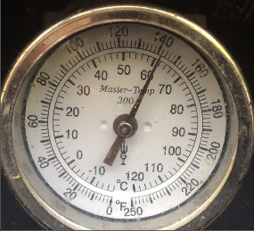 A thermometer reading about 140 degrees F.