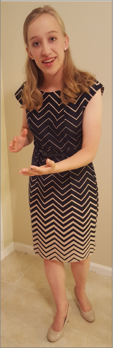 girl displaying proper hand gestures for a 4-H public speaking competition. 