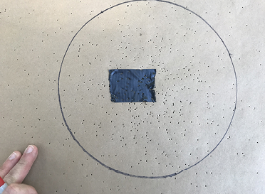 A 10-inch circle is drawn on a target to determine pellet count.