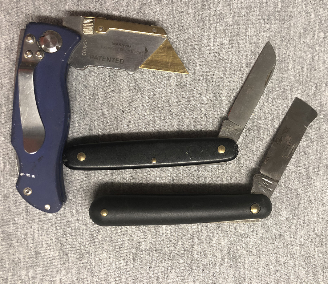 A box cutter, a grafting knife, and a budding knife opened to show blades.