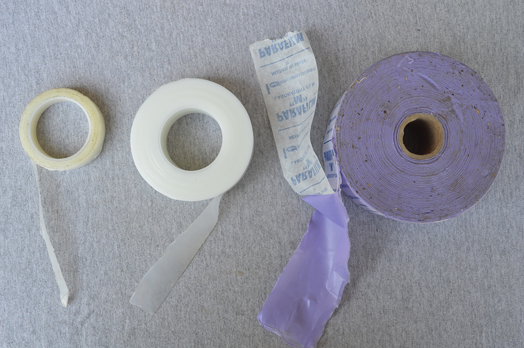 Three rolls of stretchable film of different sizes.