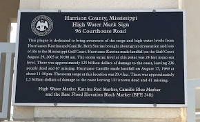 A plaque with information on the impacts of Hurricanes Camille and Katrina to the Mississippi Gulf Coast.
