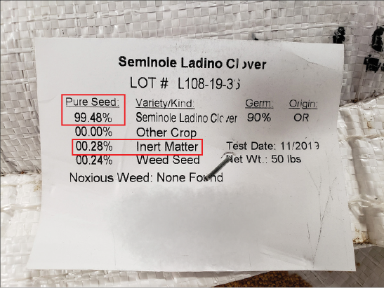 A seed label for Seminole Ladino Clover. Boxes are drawn to highlight that the pure seed percent is 99.48, and inert matter is 00.28 percent.