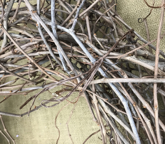As the foundation for the wreath dries, there may be some places that need added security. Brown paper covered wire is ideal for binding any loose vines with a secure knot.