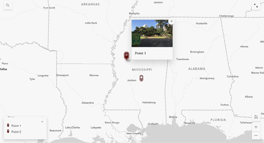Gray and white map of the southern states with two maroon pin graphics and a pop-up photo of a park in Mississippi.
