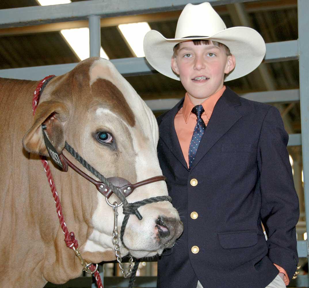 Lane Valentine, 12, of Bay Springs, sold his reserve champion Brahman steer Thursday at the Dixie National Sale of Junior Champions in Jackson. (Photo by Bonnie Coblentz)