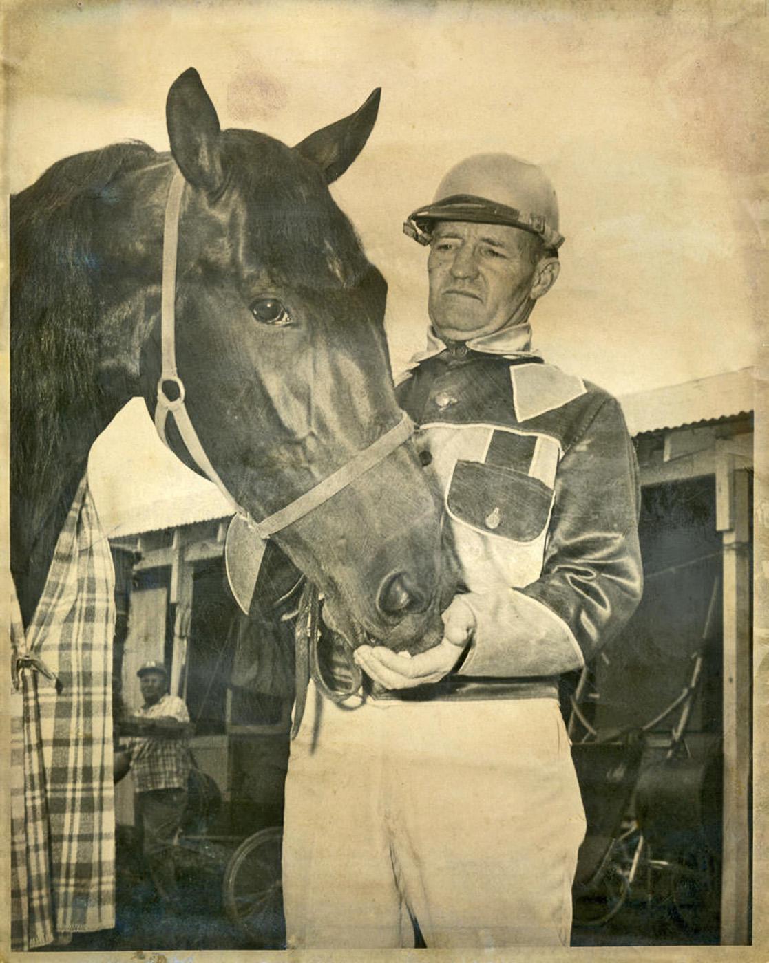 Tom Wilburn, a 1940 animal husbandry graduate from Mississippi State College, is pictured many years ago with his harness-race horse, Trotwood Roy. (Submitted photo)