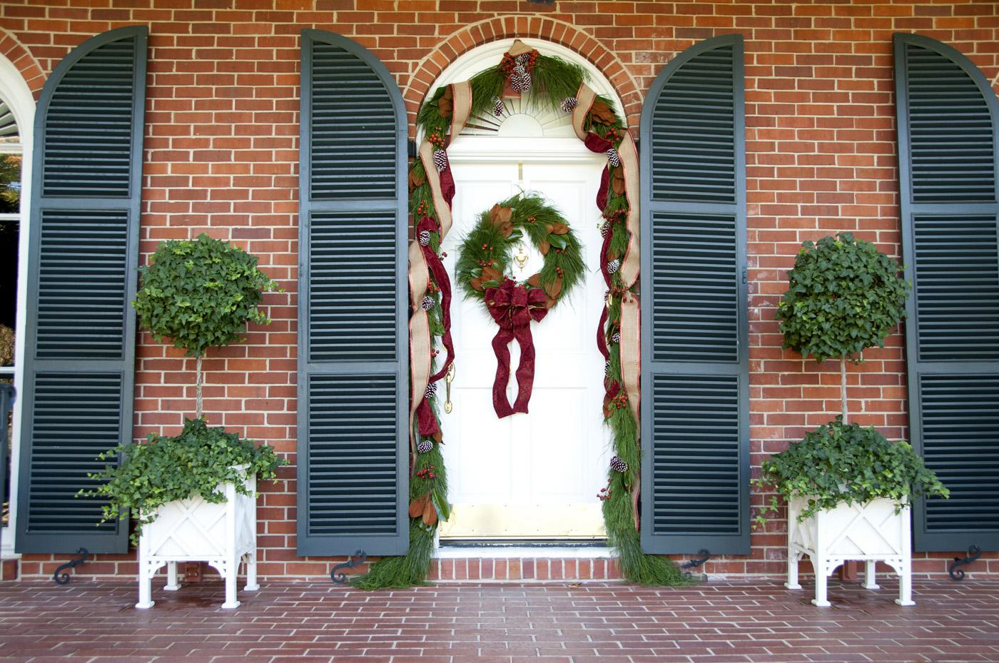 Mississippi State University president Mark Keenum and his family have a pine and magnolia wreath and garland adorning their door this holiday season. The wreath was made by Wm. Puckett, Inc. and the garland is from the Fresh Garland Company. Both items are available for purchase at The University Florist. (Photo by Kat Lawrence)
