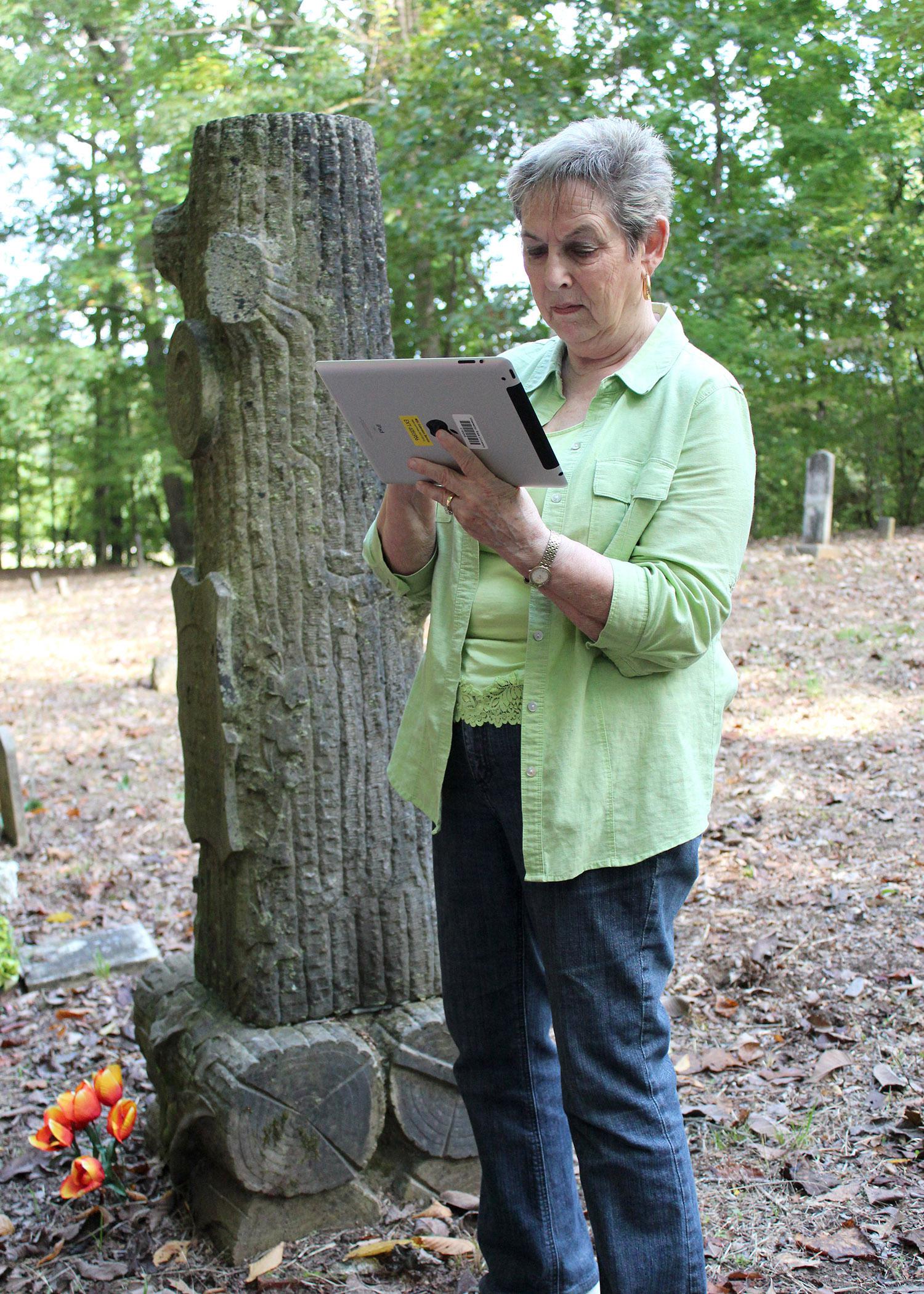 Faye Hollingsworth maps the Duval Cemetery in Itawamba County on a tablet computer during a Mississippi State University Extension Service technology workshop. (Photo by MSU Ag Communications/Keri Collins Lewis)