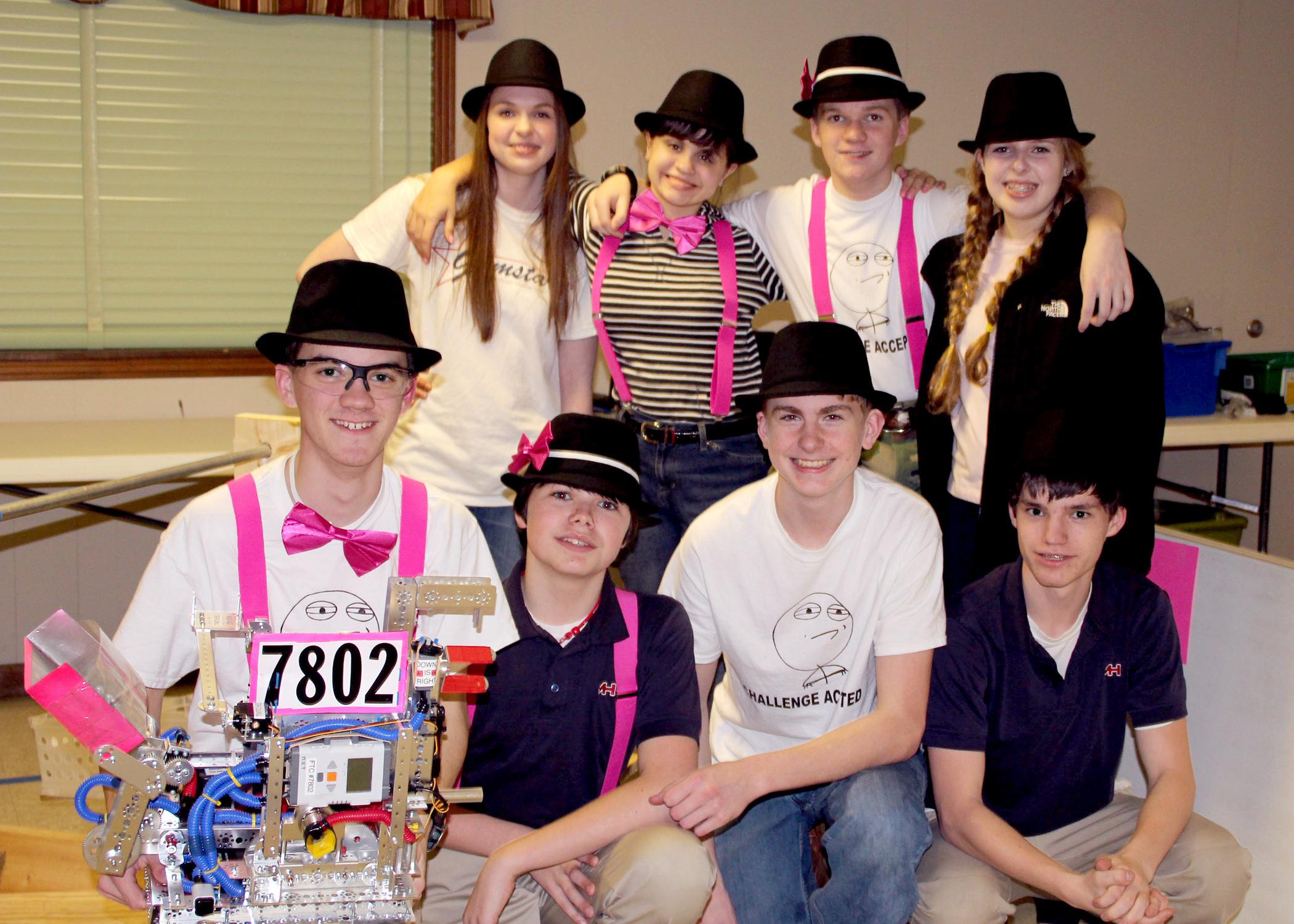 The "Challenge Accepted" robotics team celebrates winning the Feb. 7-8, 2014, state competition in Oxford, Miss. They include (front row, from left) Nathan Rodgers (holding Geoff the robot), Cade Holliday, Will Gaines and Chandler Holliday, and (back row, from left) Jill Gautier, Skyler Smith, Jon Rodgers and Paige Gautier. (Submitted Photo)