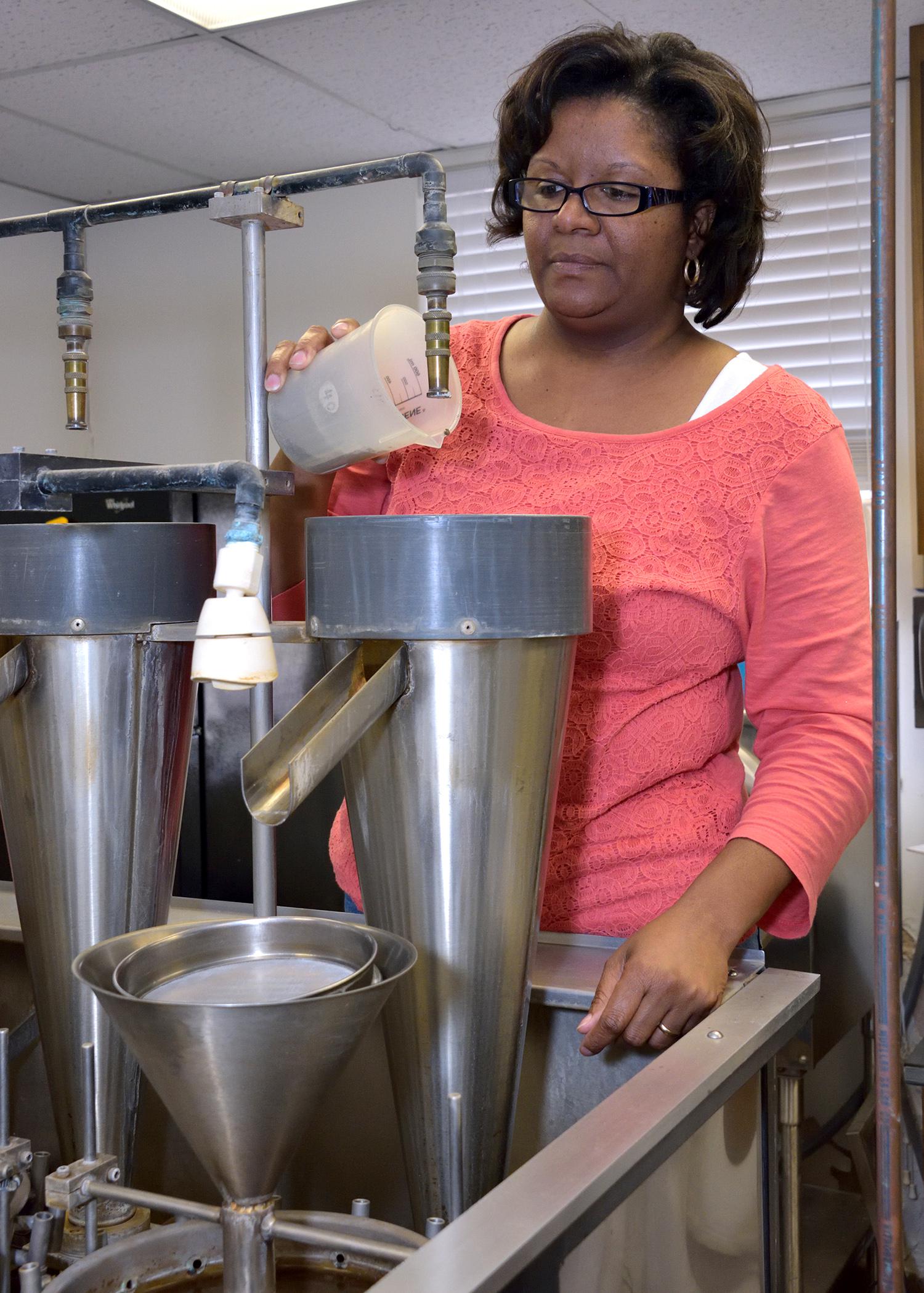 Karen Coats, a lab technician at the Mississippi State University Plant Disease and Nematode Diagnostic Laboratory, begins testing a soil sample to detect nematodes on Oct. 23, 2014. (Photo by MSU Ag Communications/Kevin Hudson)