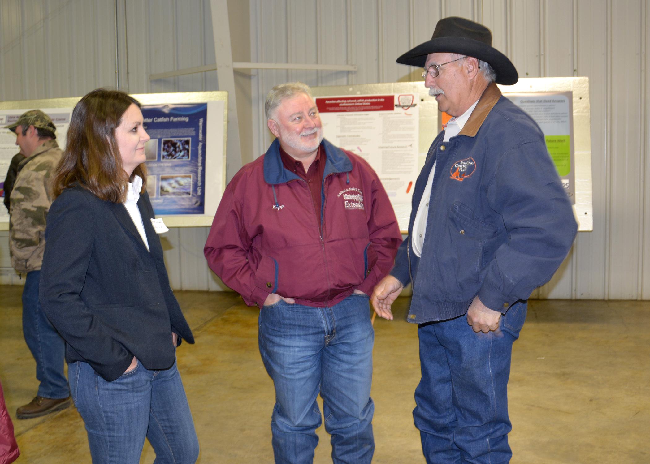 Jane Parish, extension and research professor of animal science with Mississippi State University, and Kipp Brown, area extension associate in Carroll County, visit with Webster County horseman John Fondren at the North Mississippi Research and Extension Center Producer Advisory Council meeting in Verona, Mississippi, on Feb. 19, 2015. (Photo by MSU Ag Communications/Linda Breazeale)