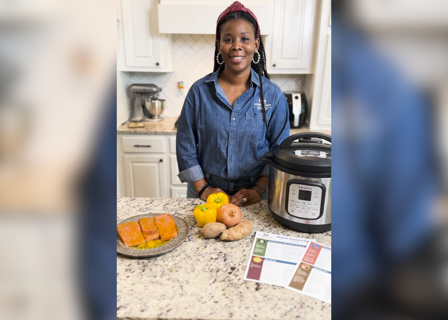 A woman stands in a kitchen with an electric pressure cooker.