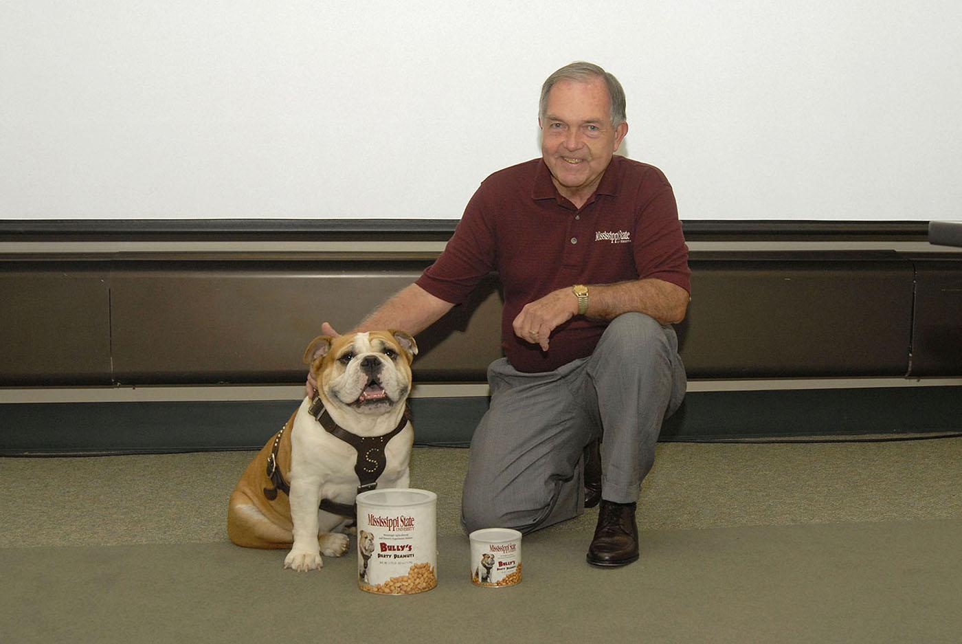 The Mississippi State University Cheese Store now sells peanuts to help promote consumption in the state. Pictured with two of the products are Bully, MSU's mascot, and Dr. Vance Watson, vice president for the Division of Agriculture, Forestry and Veterinary Medicine. Photo by Tom Thompson.