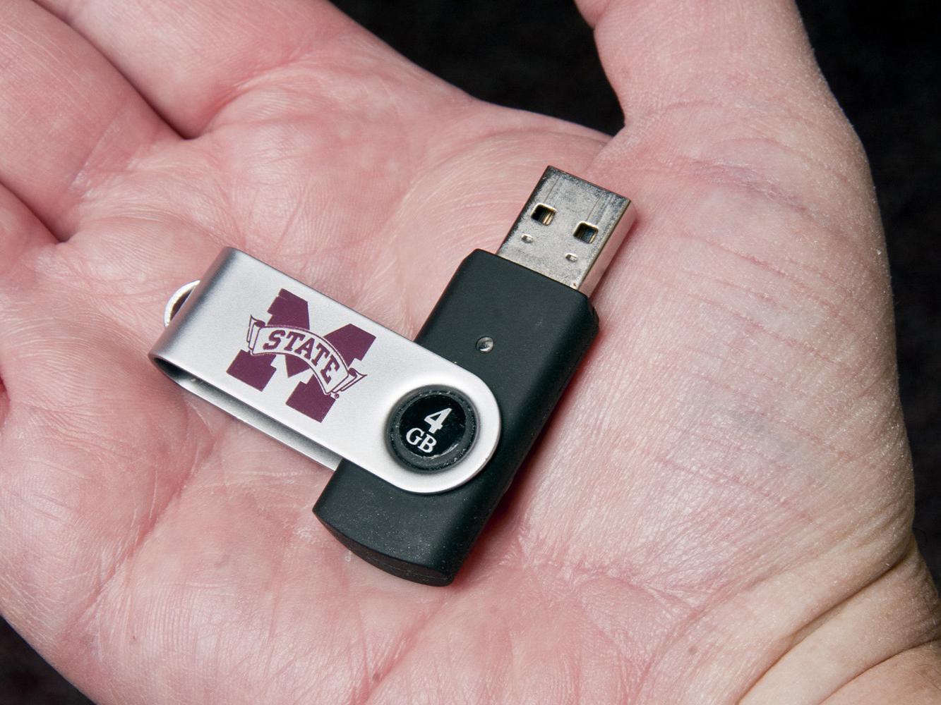 A USB (universal serial bus) flash drive is a small device that fits in a palm. It allows for the rapid transfer of data from the computer to the flash drive and from the flash drive to the computer. A 4GB USB flash drive costs less than $10.  (Photo by Scott Corey)