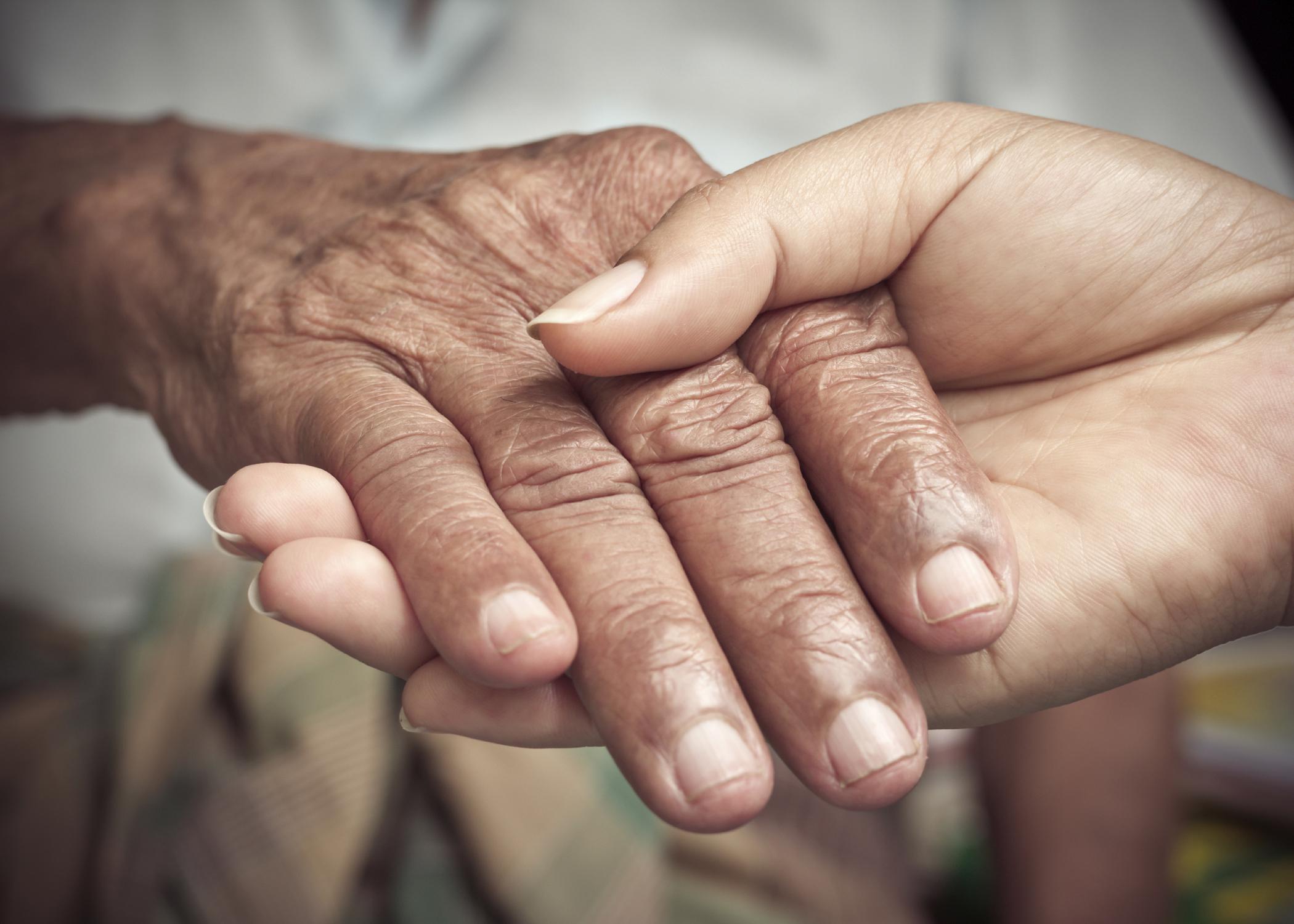 Communication with other family members can help caregivers balance the task with family obligations, work and self care. (Photo by iStock)