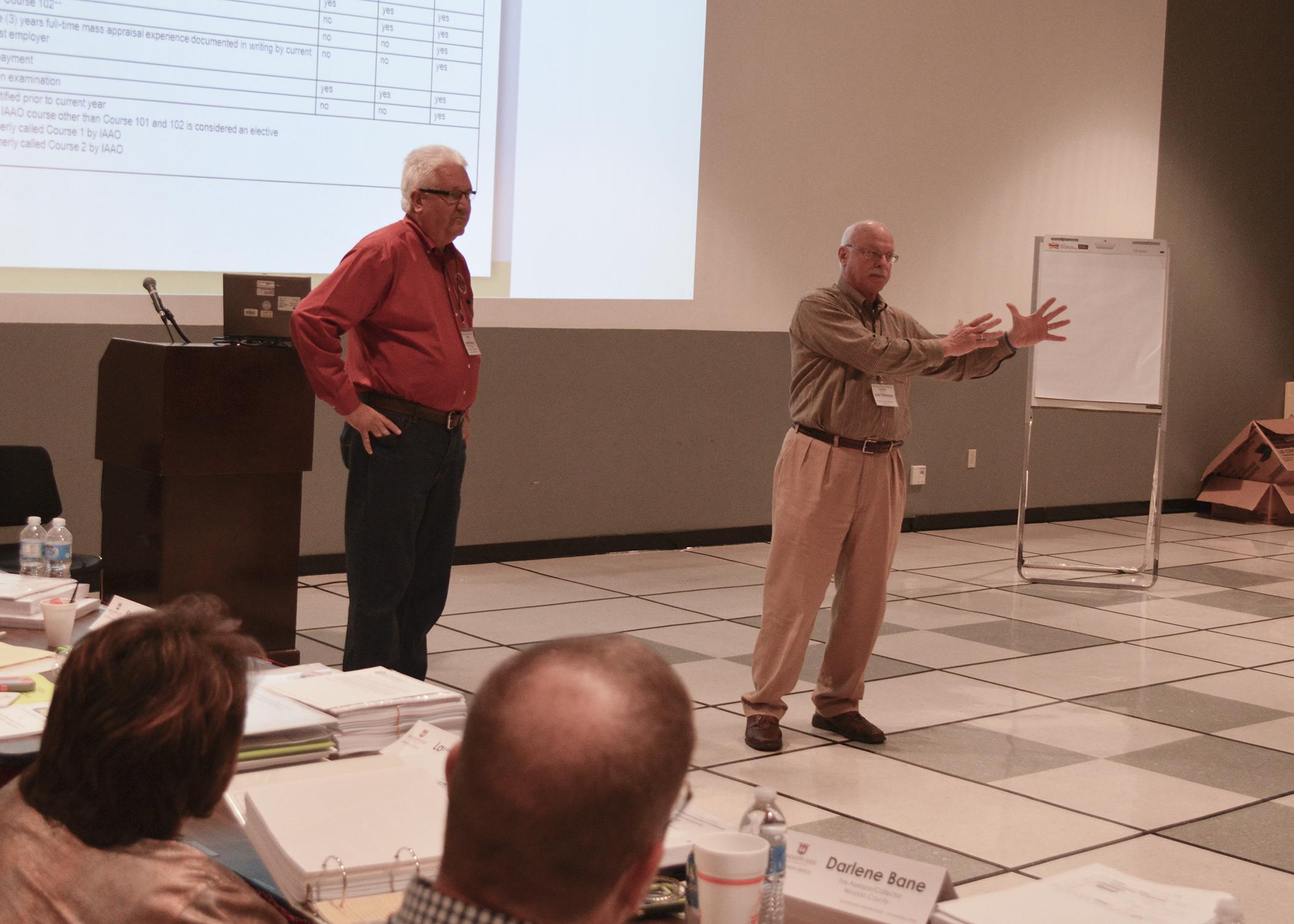 Hancock County tax assessor Jimmie Ladner Jr., left, and Mississippi Assessors and Collectors Association executive director Joel Yelverton brief newly elected tax assessors during a training held at the Mississippi State University Bost Extension Center Nov. 18, 2015. (Photo by Bob Ratliff, MSU Extension)