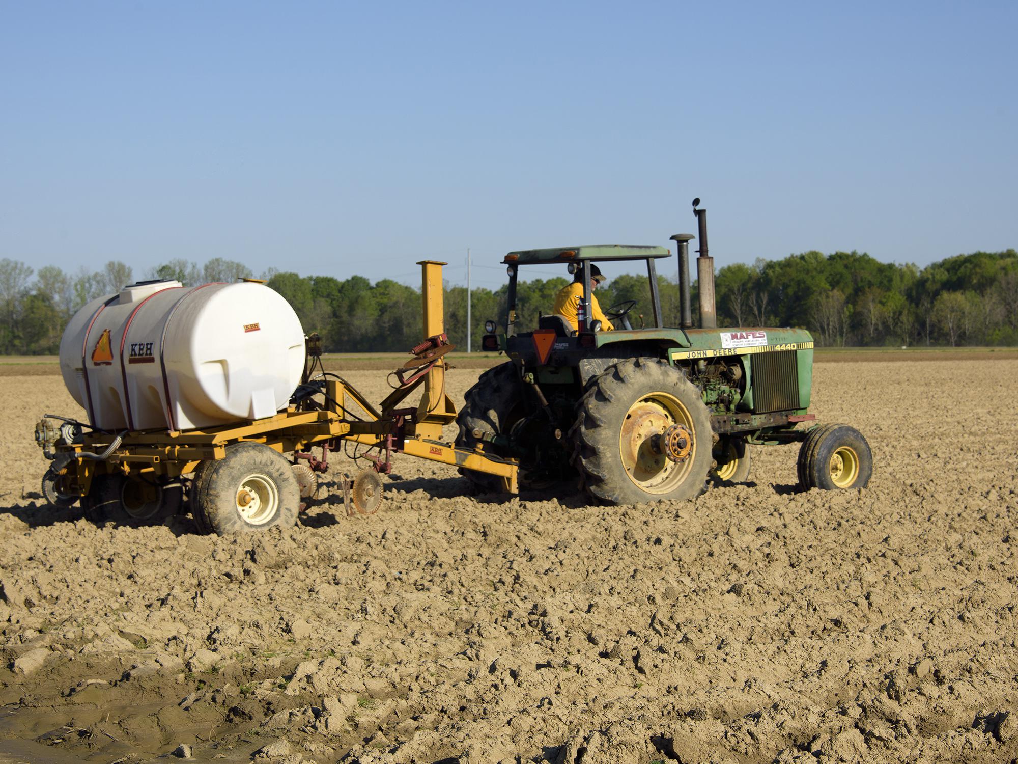 Eddie Stevens, farm supervisor at Mississippi State University’s R. R. Foil Plant Science Research Center in Starkville, was applying a liquid fertilizer to a corn field on April 5, 2016. Correct application of nutrients is a key part of environmental stewardship and efficient farm management. (Photo by MSU Extension Service/Kevin Hudson)