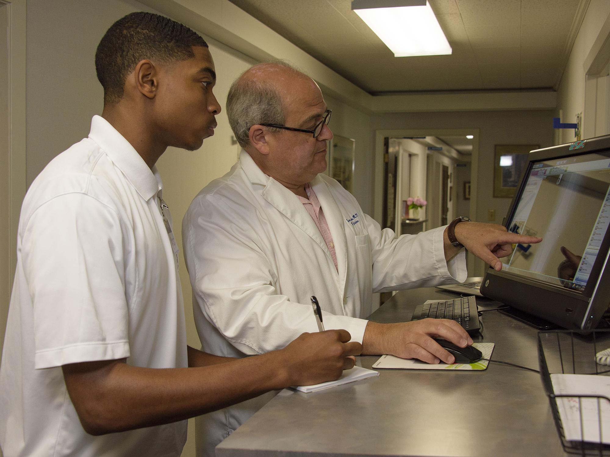 This high school student observes a family practice doctor at work during the 2016 Rural Medical Scholars summer program at Mississippi State University. Applications and program details for 2017 are available online at http://www.extension.msstate.edu/rms/. (Photo by MSU Extension Service/Kevin Hudson)