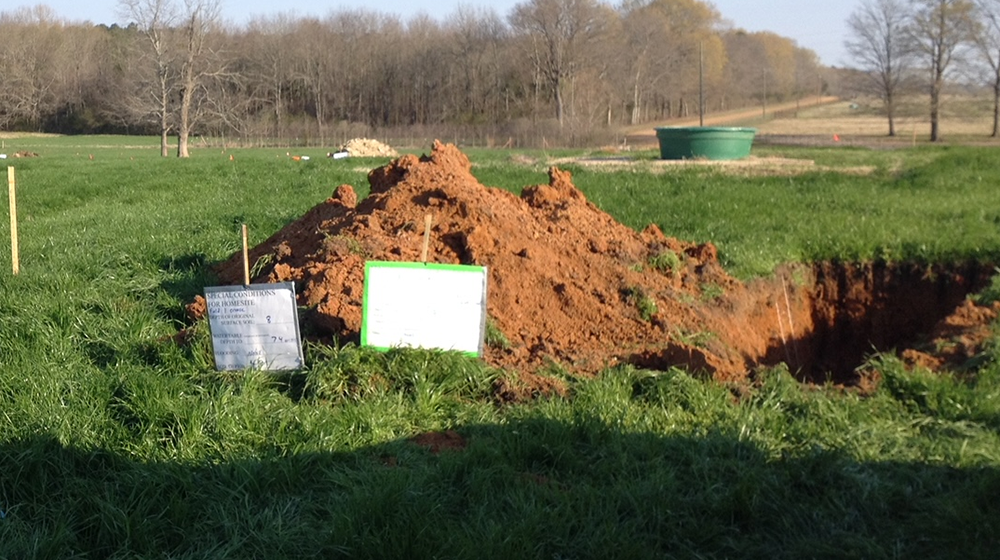 Excavated soil pits on the H. H. Leveck Animal Research Center at MSU.