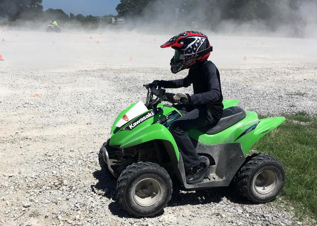 Person on a green ATV