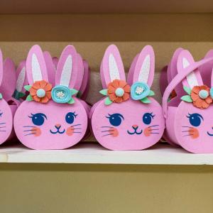 A shelf of pick bunny candy holders.