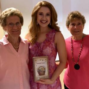 Two women who attended the Breast Cancer Awareness Luncheon pictured with speaker Molly May.  