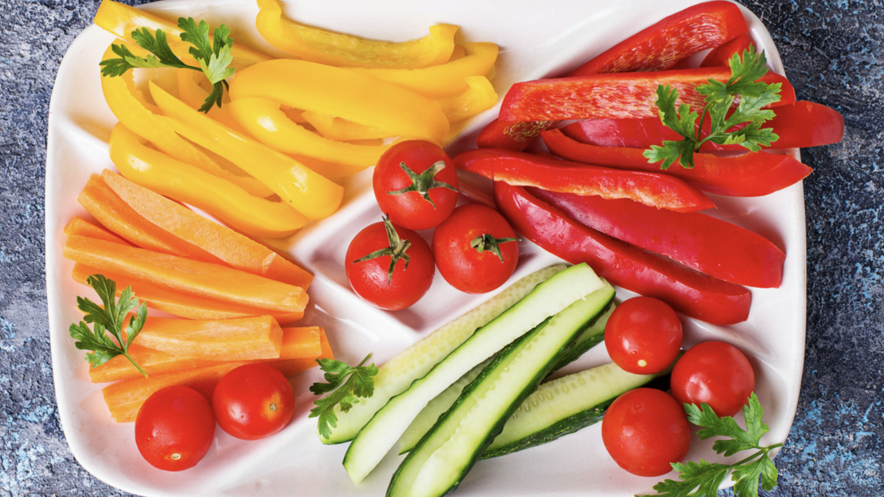 sliced bell peppers and cucumbers on a plate