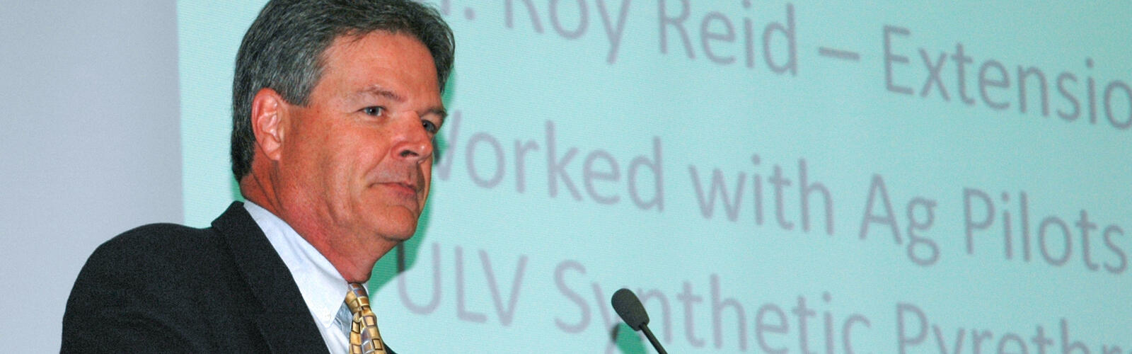 A person standing at a podium.