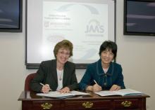 Melissa Mixon, left, and Xiaoxi Lu recently signed a five-year general agreement for academic cooperation between Mississippi State University and China's Jiangsu Academy of Agricultural Sciences. (Photo by Marco Nicovich)