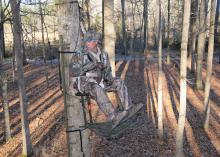 John Louk with the Treestand Manufacturer's Association demonstrates a properly secured safety harness when using a portable, lock-on tree stand. (File photo courtesy of the Treestand Manufacturer's Association)