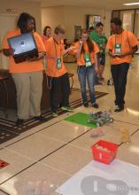 Jackson County 4-H members Ny’kqwria Crear (left), Mark Lewis, Alysia Rester and Jerrick Dubose prepare to send their robot through a challenge course during competition on June 1, 2017. More than 700 4-H members took part in contests, workshops, tours and entertainment during their annual state meeting at Mississippi State University. (Photo by MSU Extension Service/Linda Breazeale)