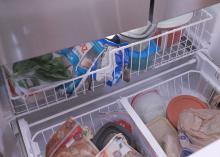 Frozen foods sit in the freezer.
