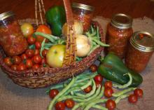 Canned salsa in a basket with other produce