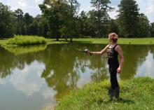 This young angler is actually helping an Oktibbeha County pond grow larger fish. Pond and lake managers need to harvest 1 pound of bass to 5 pounds of bream, usually beginning in the third year after stocking, to promote larger fish. (MSU Extension Service file photo/Linda Breazeale)