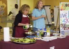 Angie Crawford, left, and Mari Alyce Earnest of the Mississippi State University Extension Service office in Quitman County deliver a nutrition education program Sept. 13, 2016, at the community center in Lambert, Mississippi. Extension works with several area organizations to provide food for about 800 underserved families every other month. (Photo by MSU Extension Service/Kevin Hudson)
