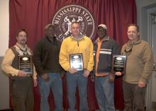 Mississippi State University facility managers were honored for their efforts to maintain Mississippi Agricultural and Forestry Experiment Station branches. From left are research professor Mark Shankle of the Pontotoc Ridge-Flatwoods Branch Experiment Station; agricultural technician Barzinia Smith, farm supervisor Bryant Howard and agricultural technician Wayne Sykes of the Black Belt Branch Experiment Station in Brooksville; and operations manager Peter Hudson of the Trucks Crops Branch Experiment Statio