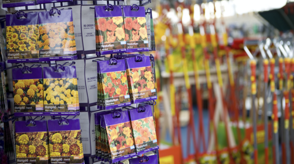 Seed packets on a display in a garden store. 