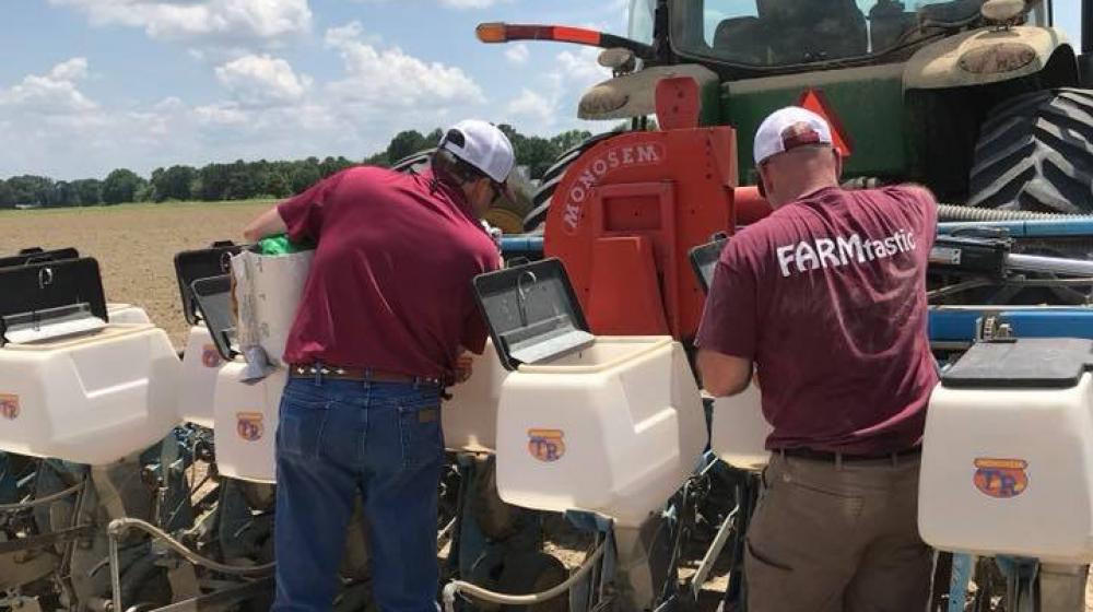 Extension Agent, Trent Barnett and Regional Agronomy Specialist , Dr. Bill Burdine working on test plots at a local farm in Calhoun County.