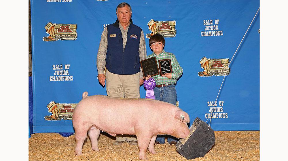 A winning pig and his owner at the Sale of Junior Champions.