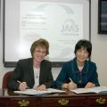 Melissa Mixon, left, and Xiaoxi Lu recently signed a five-year general agreement for academic cooperation between Mississippi State University and China's Jiangsu Academy of Agricultural Sciences. (Photo by Marco Nicovich)