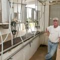 Billy Ray Brown stands on the lower level of the milking parlor he built for his Jersey cows. (Photo by Scott Corey)