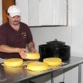 Butch Smith prepares to package cheese produced from Jersey cow milk on his family farm. (Photo by Kat Lawrence)