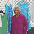 Helen Coleman, president of the Bolivar County Mississippi Homemaker Volunteers, gathers dresses created by her club to send to children in need for the MHV International Project. (Photo by MSU Ag Communications/Keri Collins Lewis)